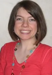 Headshot of woman in red shirt