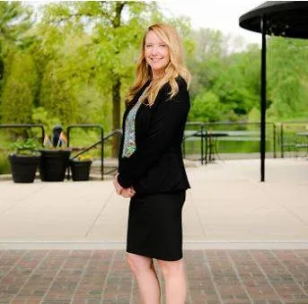 woman standing sidewise in business attire