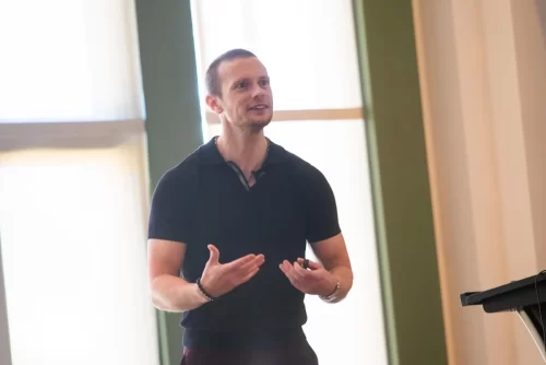 Russell-speaking-on-stage